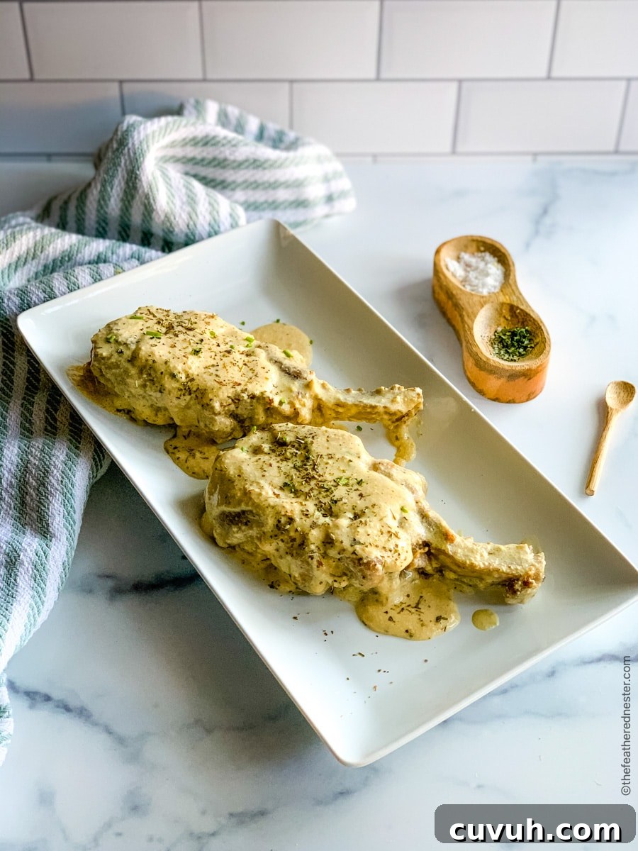 Creamy Pork Chops with Garlic Herb Sauce—Weeknight Dinner Recipe 2 platter of bone-in pork chops ready to serve