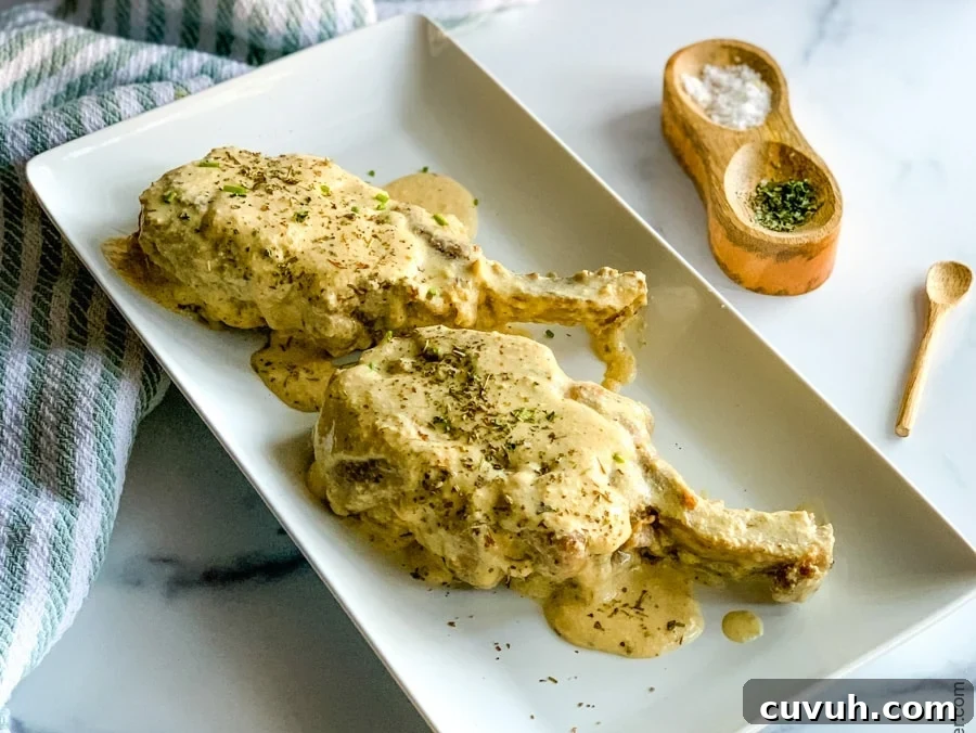 Creamy Pork Chops with Garlic Herb Sauce—Weeknight Dinner Recipe 6 platter of bone-in pork chops ready to serve.