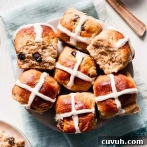 A plate full of gluten-free hot cross buns.