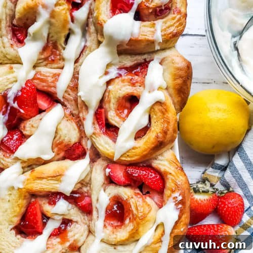 Overhead shot of strawberry rolls in a large baking dish