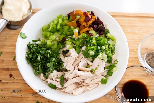 chopped ingredients in bowl for curry chicken salad recipe