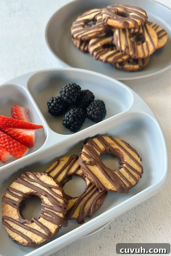 Fudge stripe cookies served with berries.