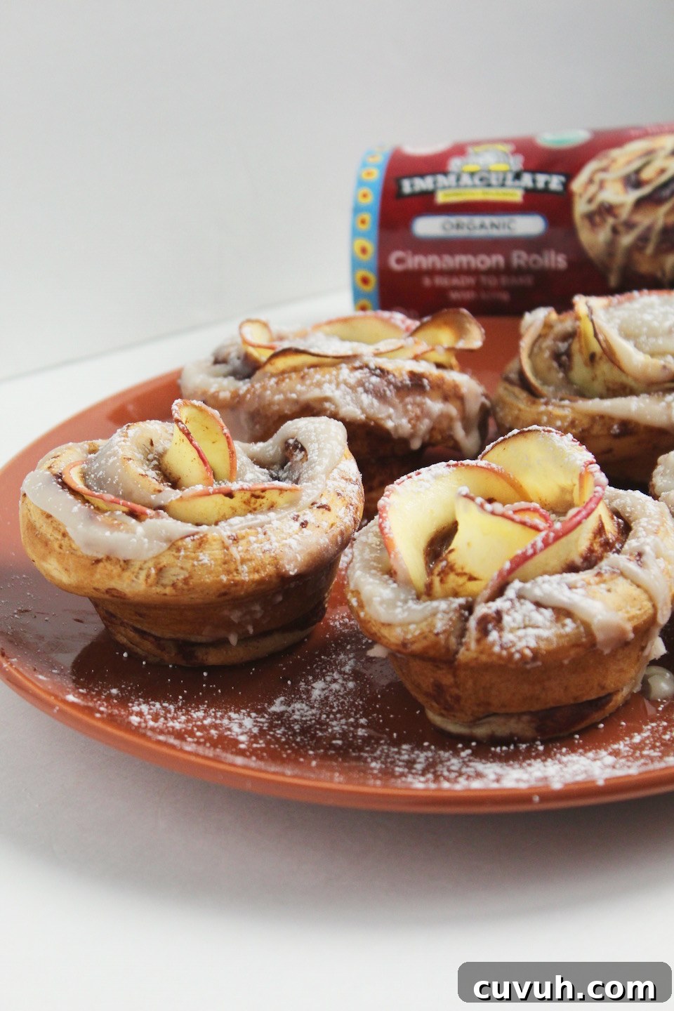 Cinnamon Roll Apple Roses Recipe -- Edible roses made with tart apple slices wrapped up in sweet and gooey cinnamon rolls.