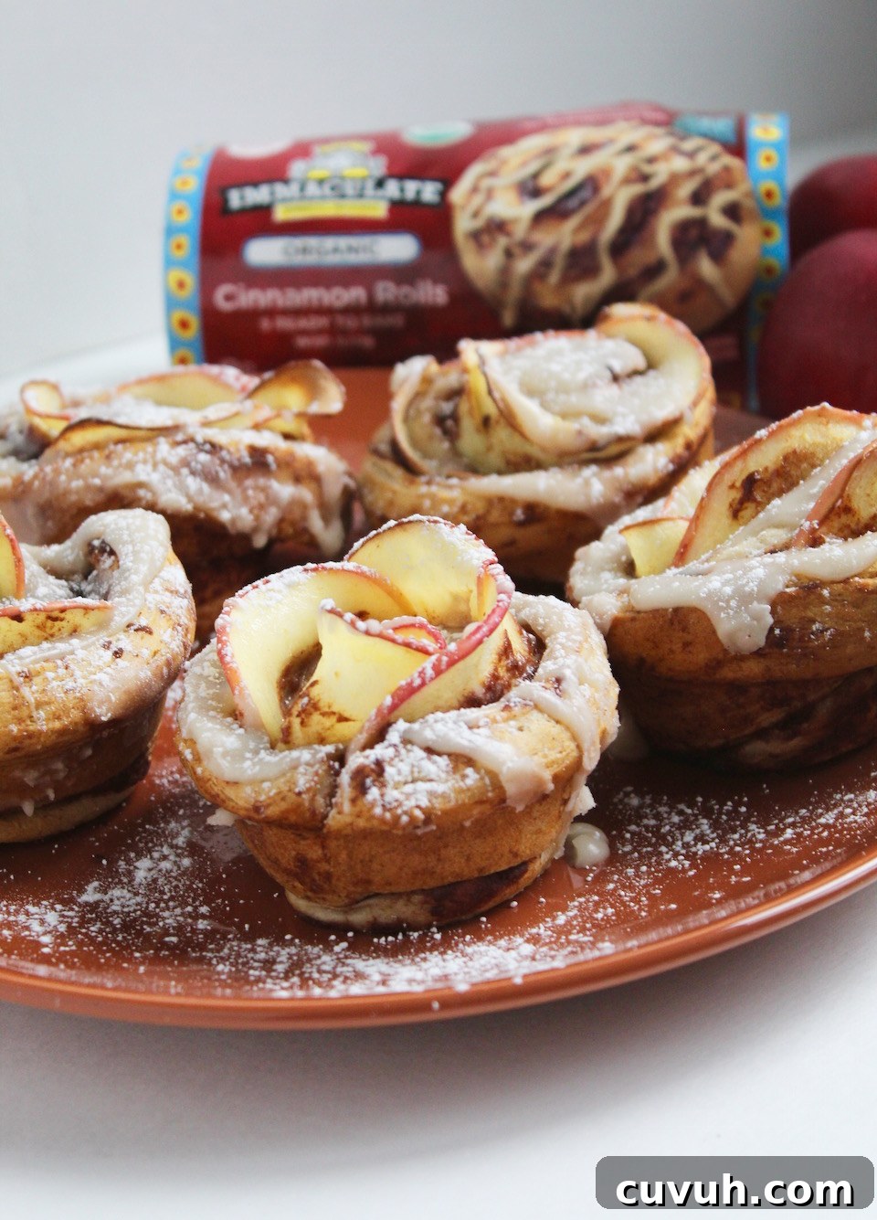 Cinnamon Roll Apple Roses Recipe -- Edible roses made with tart apple slices wrapped up in sweet and gooey cinnamon rolls.