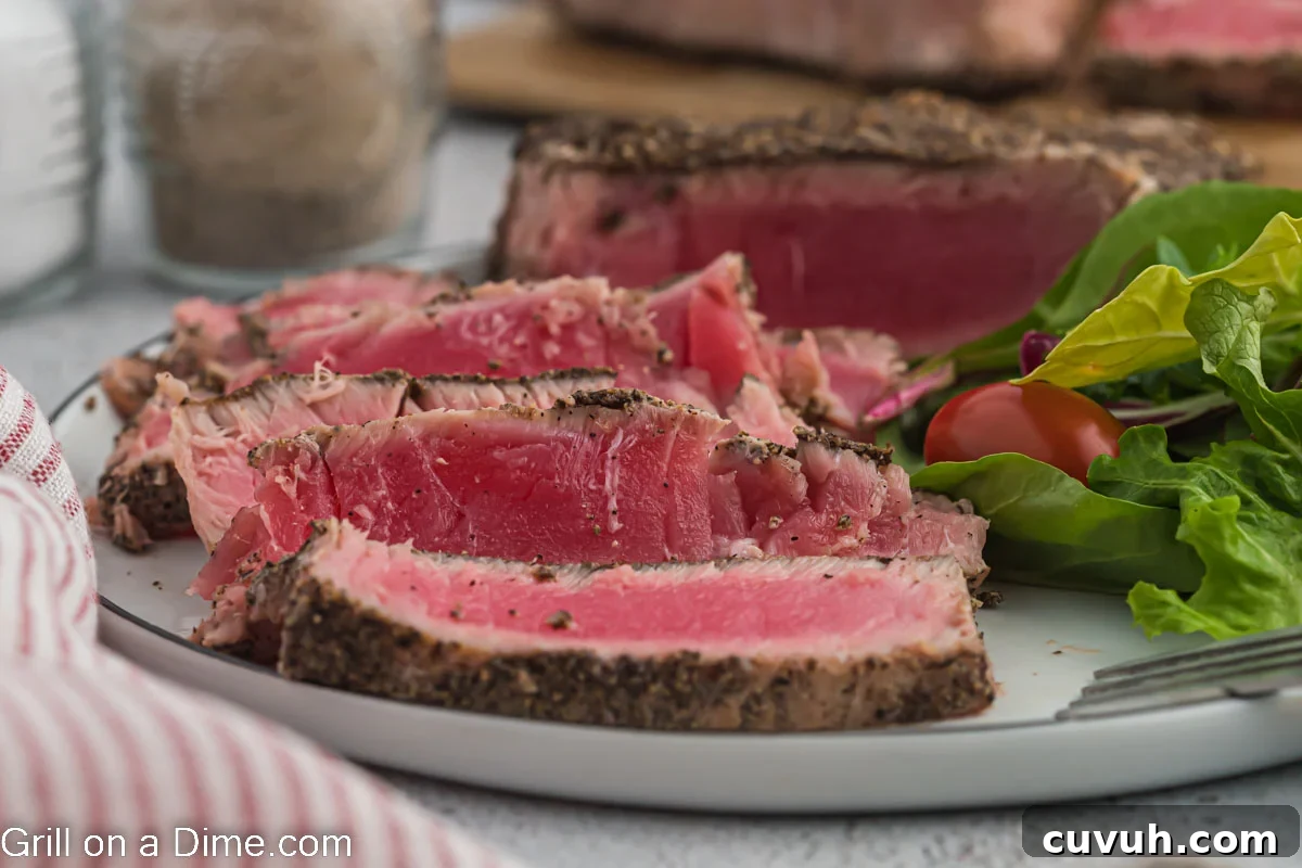 Perfectly Grilled Tuna Steaks: Marinade, Sear & Serving Tips 2 Slice Tuna Steaks on plate with garden salad