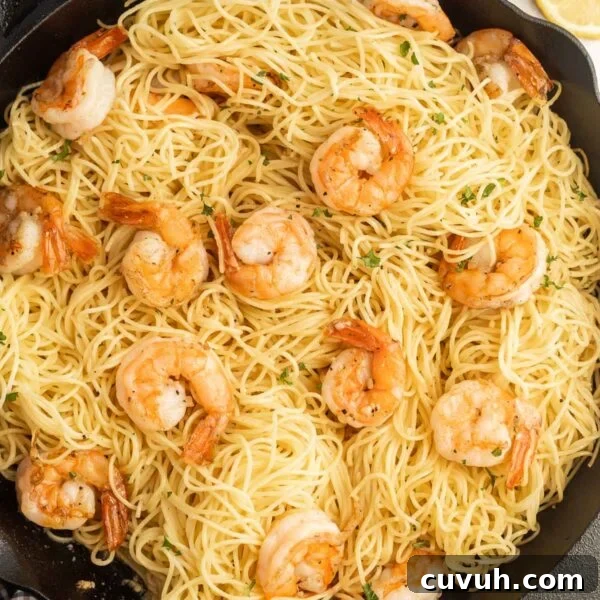 Perfectly Grilled Tuna Steaks: Marinade, Sear & Serving Tips 10 A skillet filled with spaghetti and shrimp.