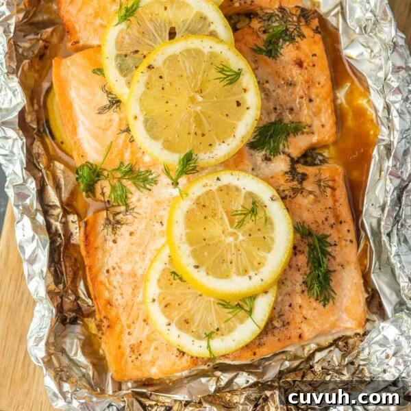 Perfectly Grilled Tuna Steaks: Marinade, Sear & Serving Tips 11 Fresh baked salmon with lemon slices and herbs in aluminum foil, perfect for healthy dinner recipes.