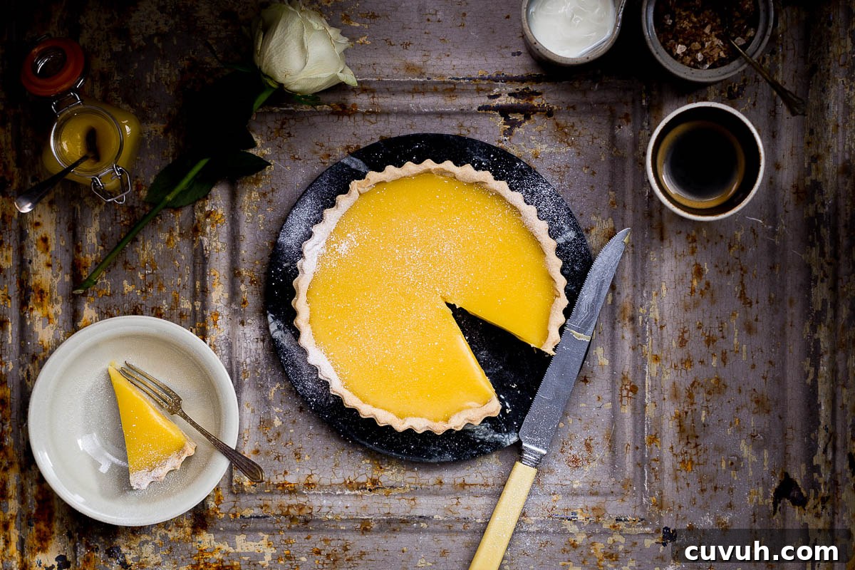 Slices of spelt tarte au citron showcasing the lemon curd and spelt crust