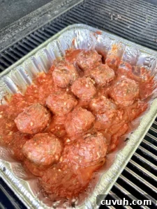 Smoked Meatball Subs Recipe: Flavorful Homemade Sandwiches 2 smoked meatballs in a pan