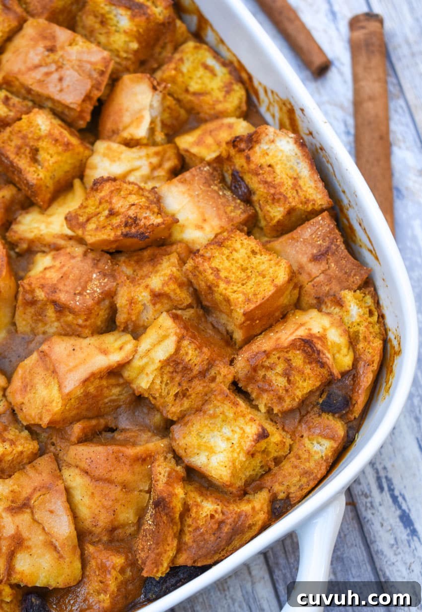 pumpkin bread pudding in a white baking dish