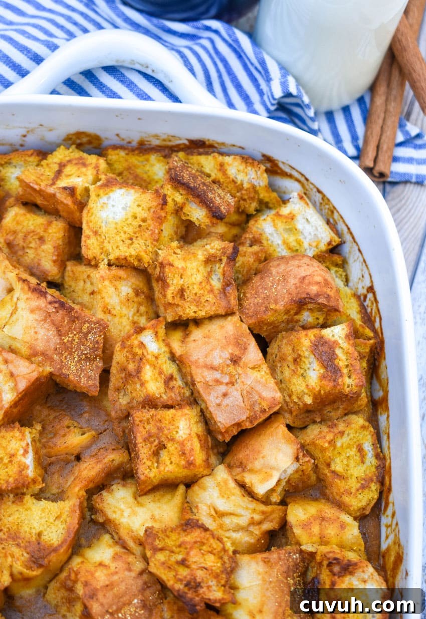 pumpkin bread pudding in a white baking dish