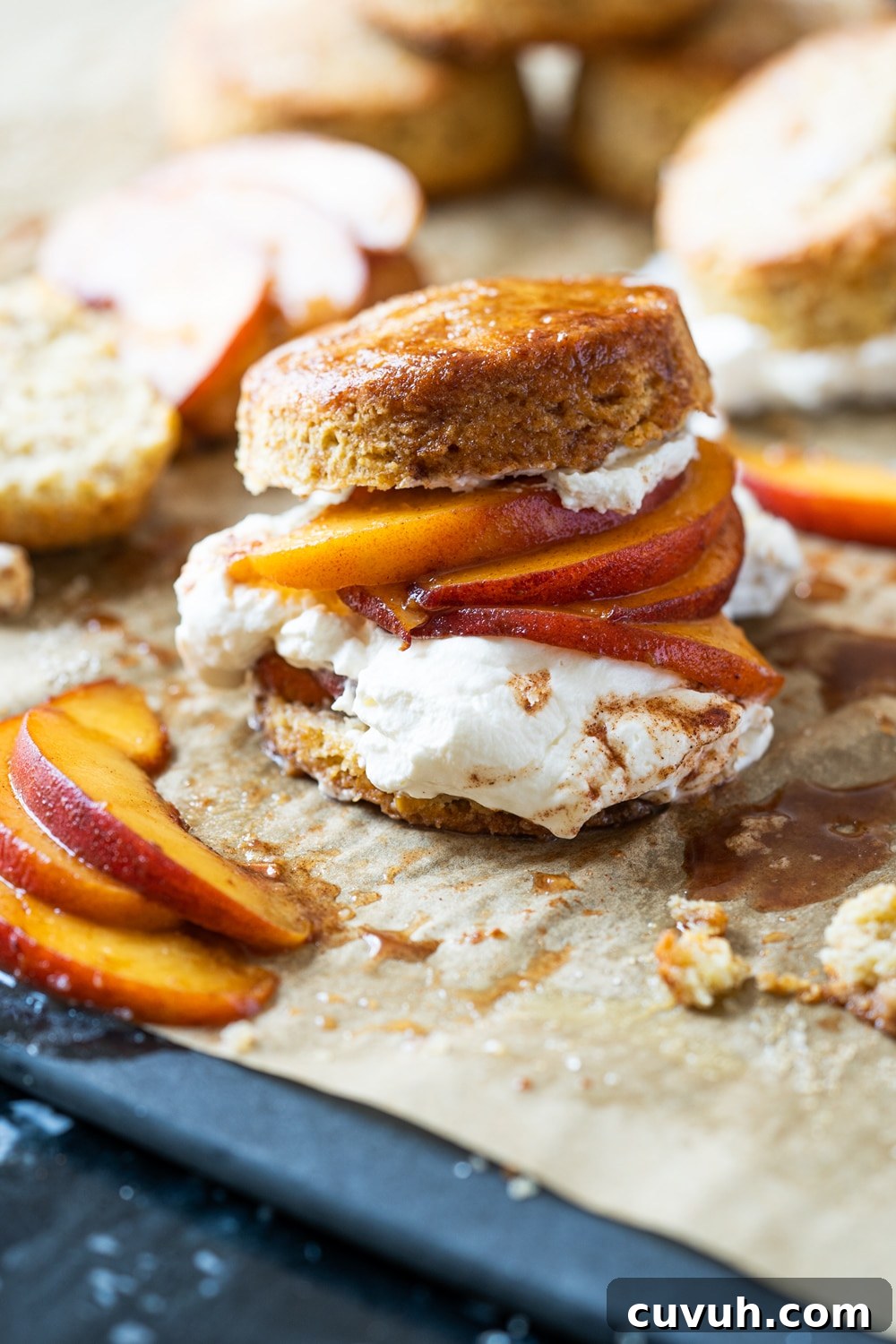 Keto Peach 'n' Cream Shortcake Recipe for Low-Carb Desserts 2 Keto peach shortcake with homemade maple whipped cream on brown parchment paper