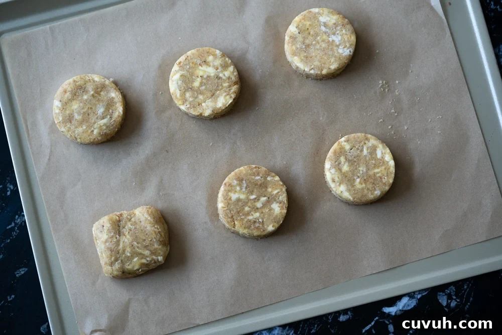 Keto Peach 'n' Cream Shortcake Recipe for Low-Carb Desserts 9 Overhead shot of six unbaked keto shortcakes on a baking tray with parchment paper