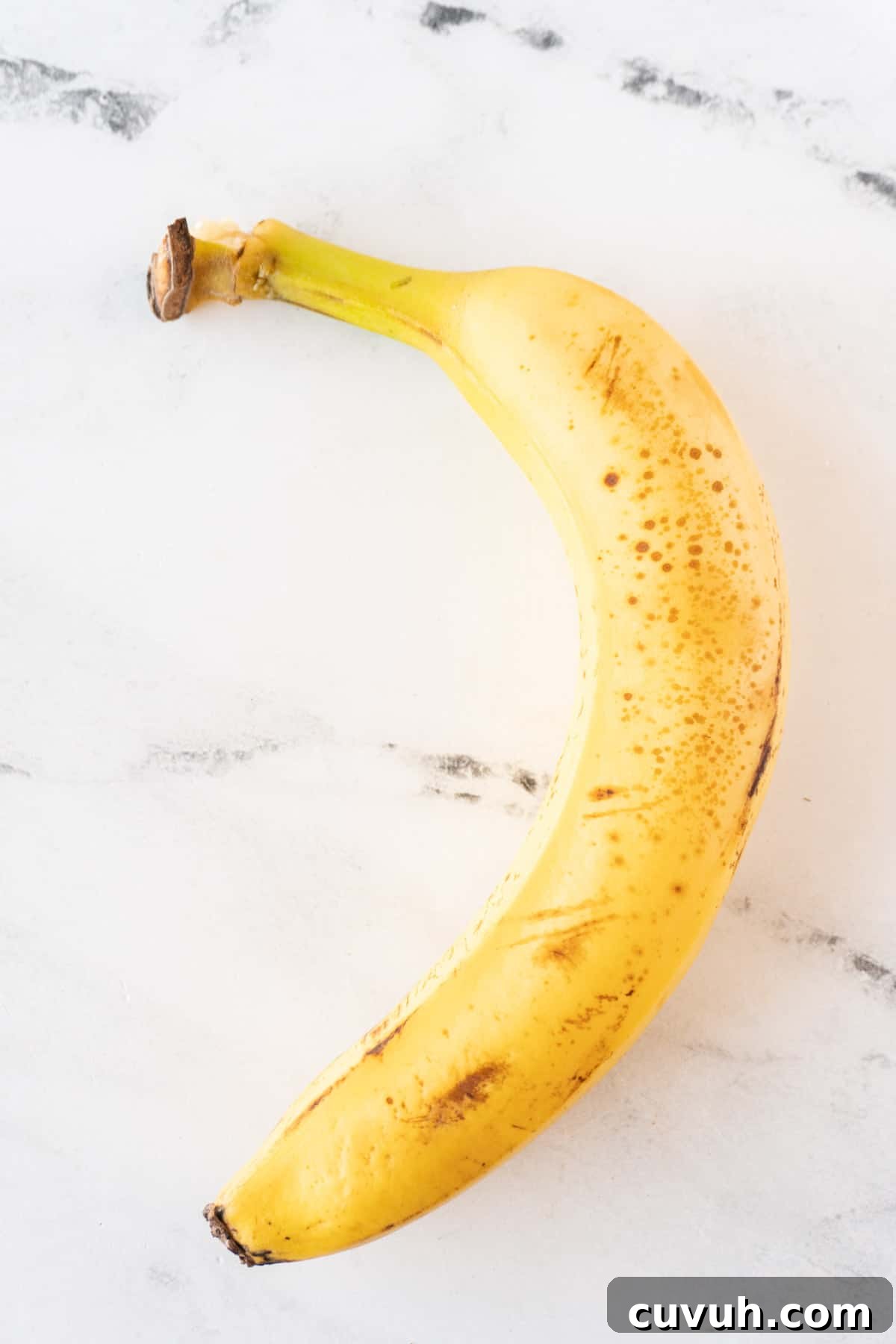 How to Freeze Bananas for Smoothies, Baking, and Snacks 11 yellow whole banana with peel on