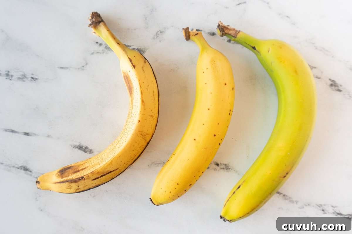 How to Freeze Bananas for Smoothies, Baking, and Snacks 3 bananas ranging from overripe to green