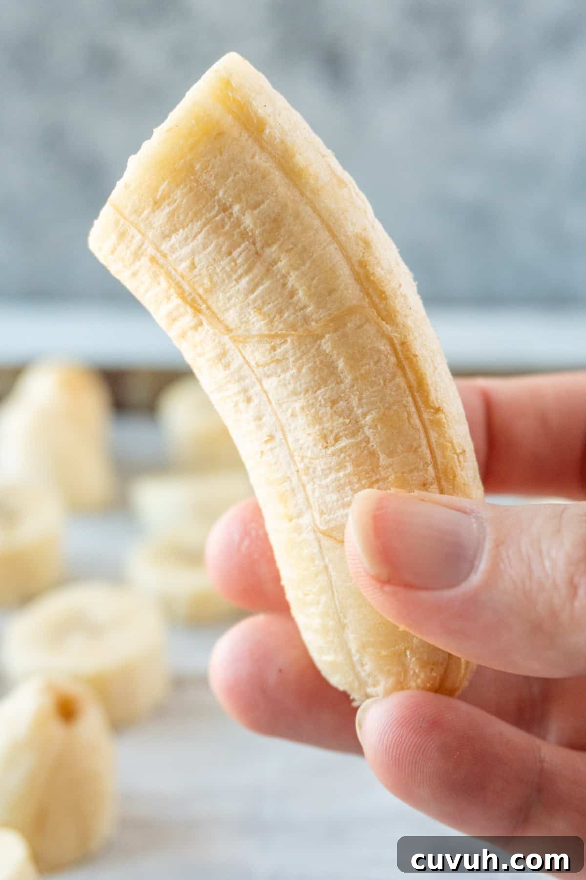 How to Freeze Bananas for Smoothies, Baking, and Snacks 7 hold frozen half banana