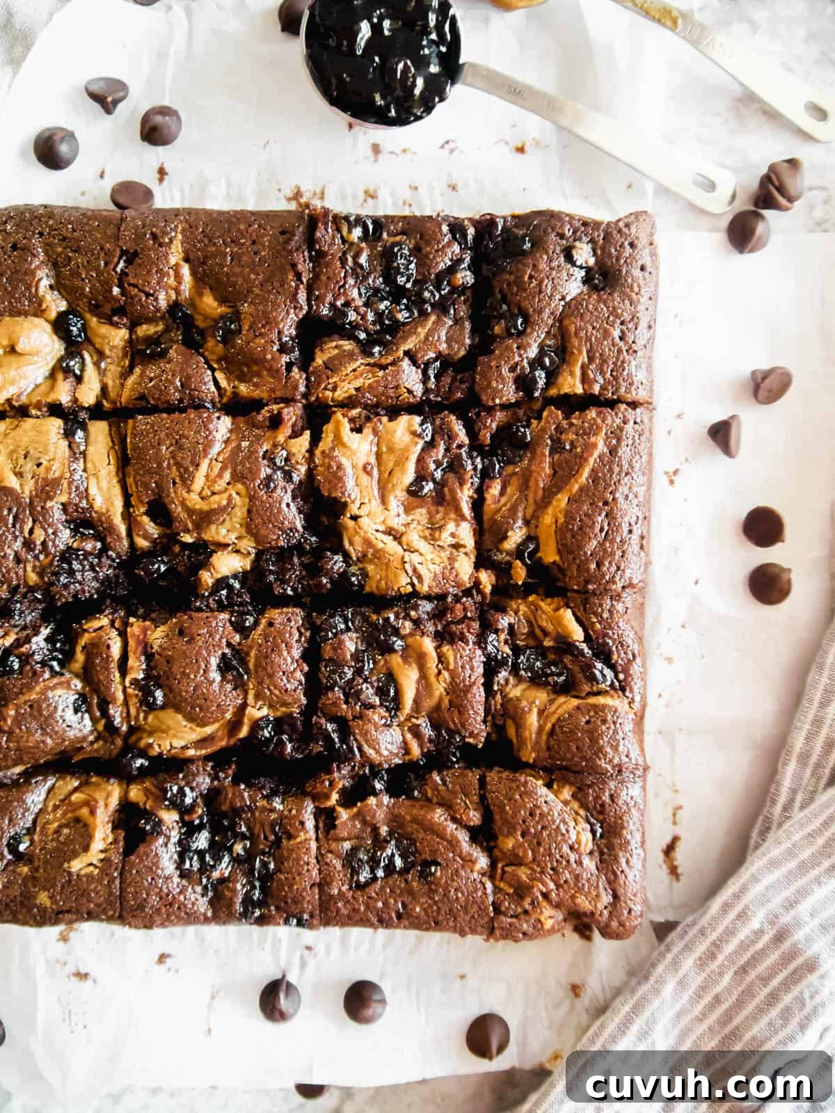 Paleo Almond Butter & Jelly Brownies — Gluten-Free Recipe 13 Swirls of almond butter and jelly on top of brownies after baking.