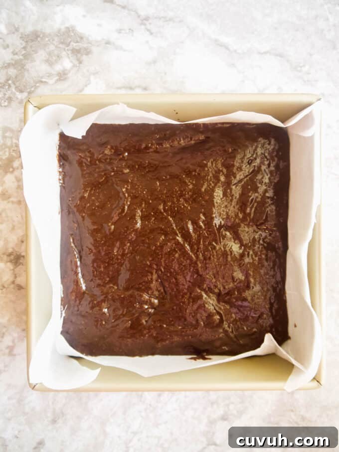 Paleo Almond Butter & Jelly Brownies — Gluten-Free Recipe 10 Brownie batter poured into pan.