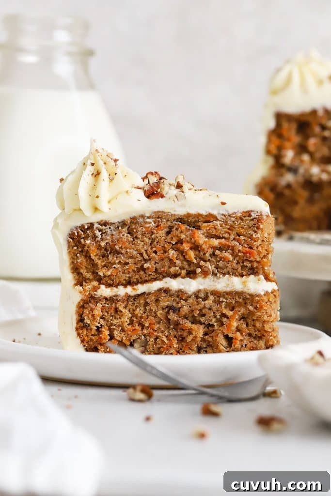 Moist Gluten-Free Yellow Sheet Cake Recipe for Parties 10 a slice of gluten-free carrot layer cake on a white plate