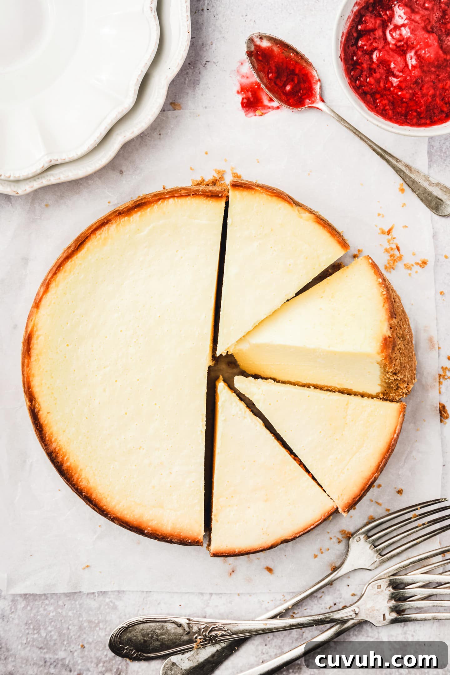 The best New york style cheesecake recipe New York cheesecake recipe sliced on a plate