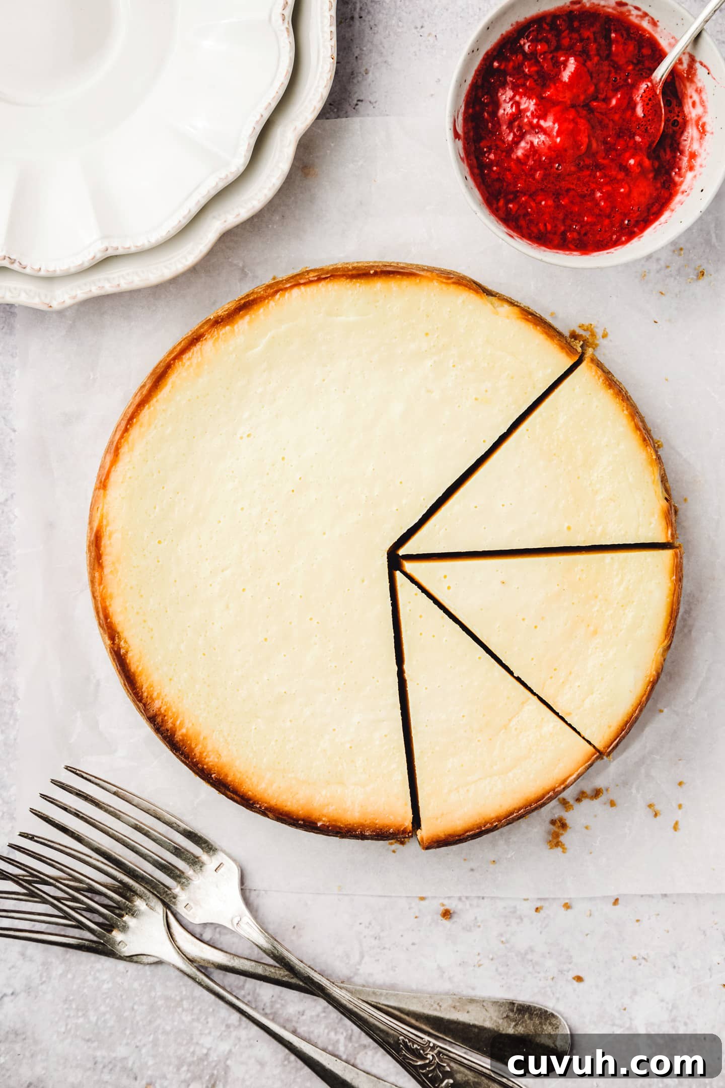 Classic New York Cheesecake Recipe: Creamy Oven-Baked Slice 2 Classic New York cheesecake cut into slices