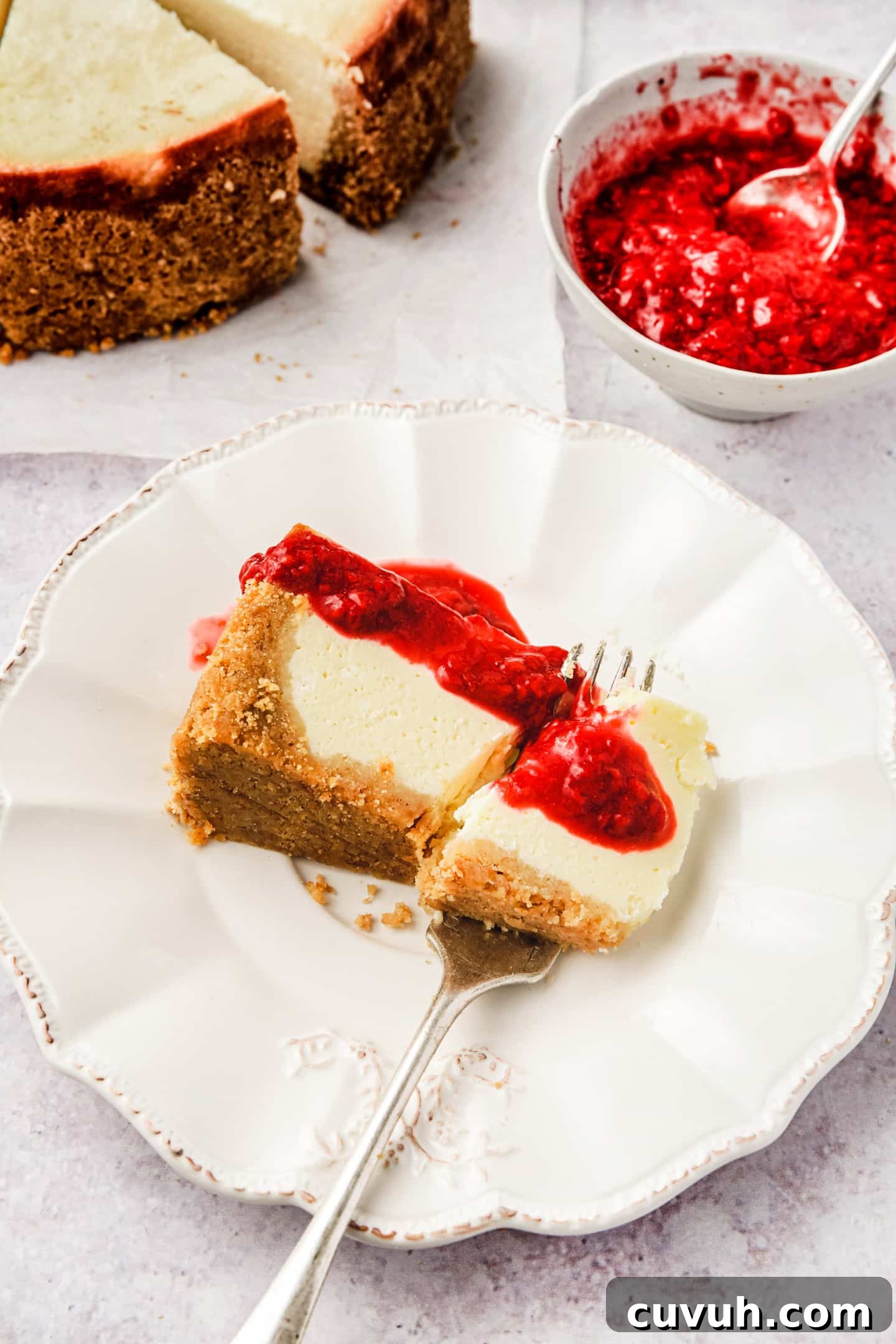 Classic New York Cheesecake Recipe: Creamy Oven-Baked Slice 7 Slice of New York cheesecake served on a plate