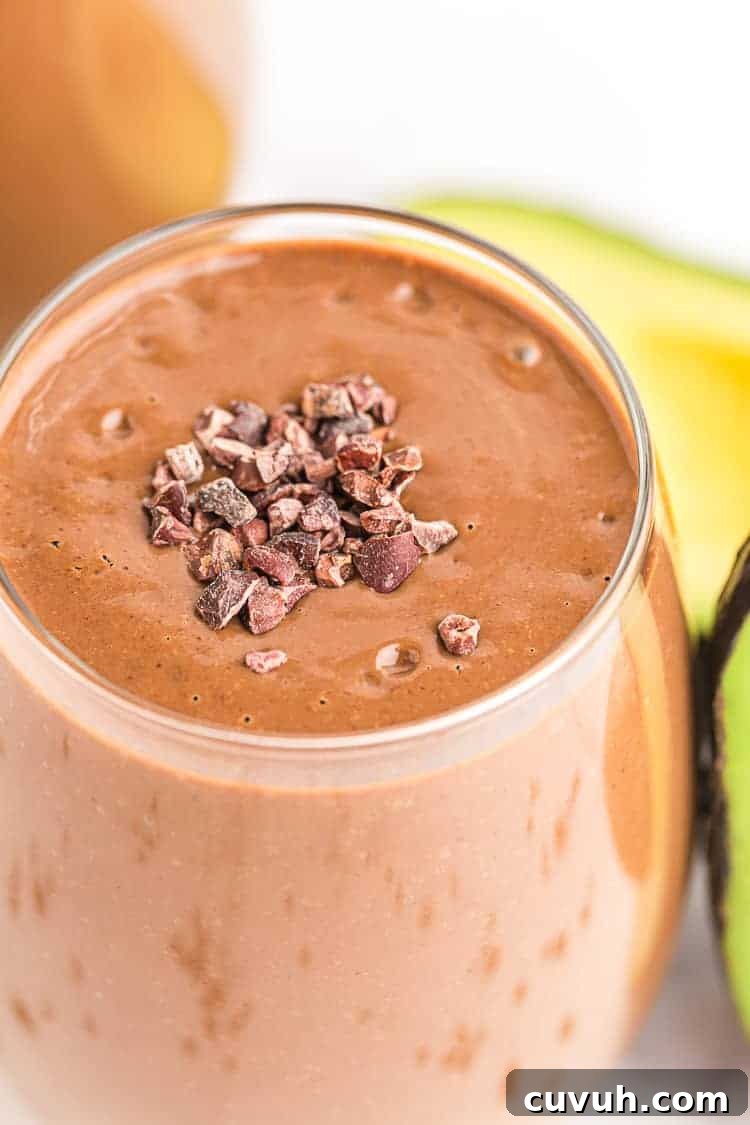 closeup of keto chocolate smoothie with cacao nibs sprinkled on top