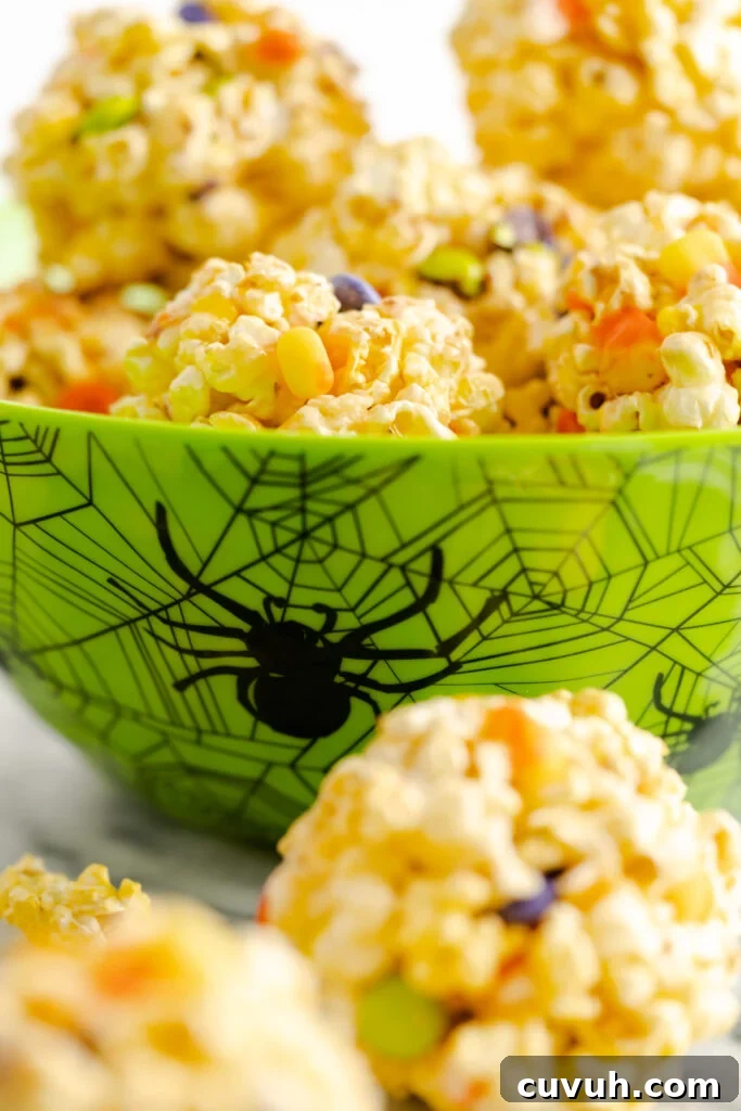 Easy popcorn balls stuffed with Halloween candy.