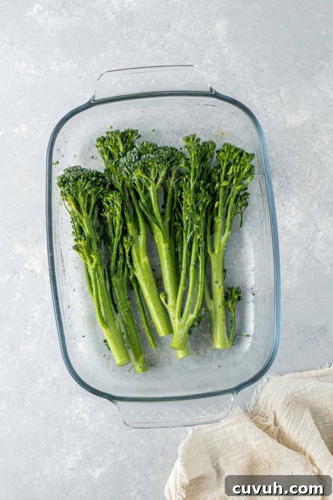 Crispy Air Fryer Broccolini with Lemon Garlic Salsa 5 Tossing the broccolini in a shallow dish.