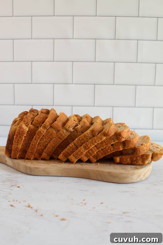 sliced loaf of millet bread on a counter.