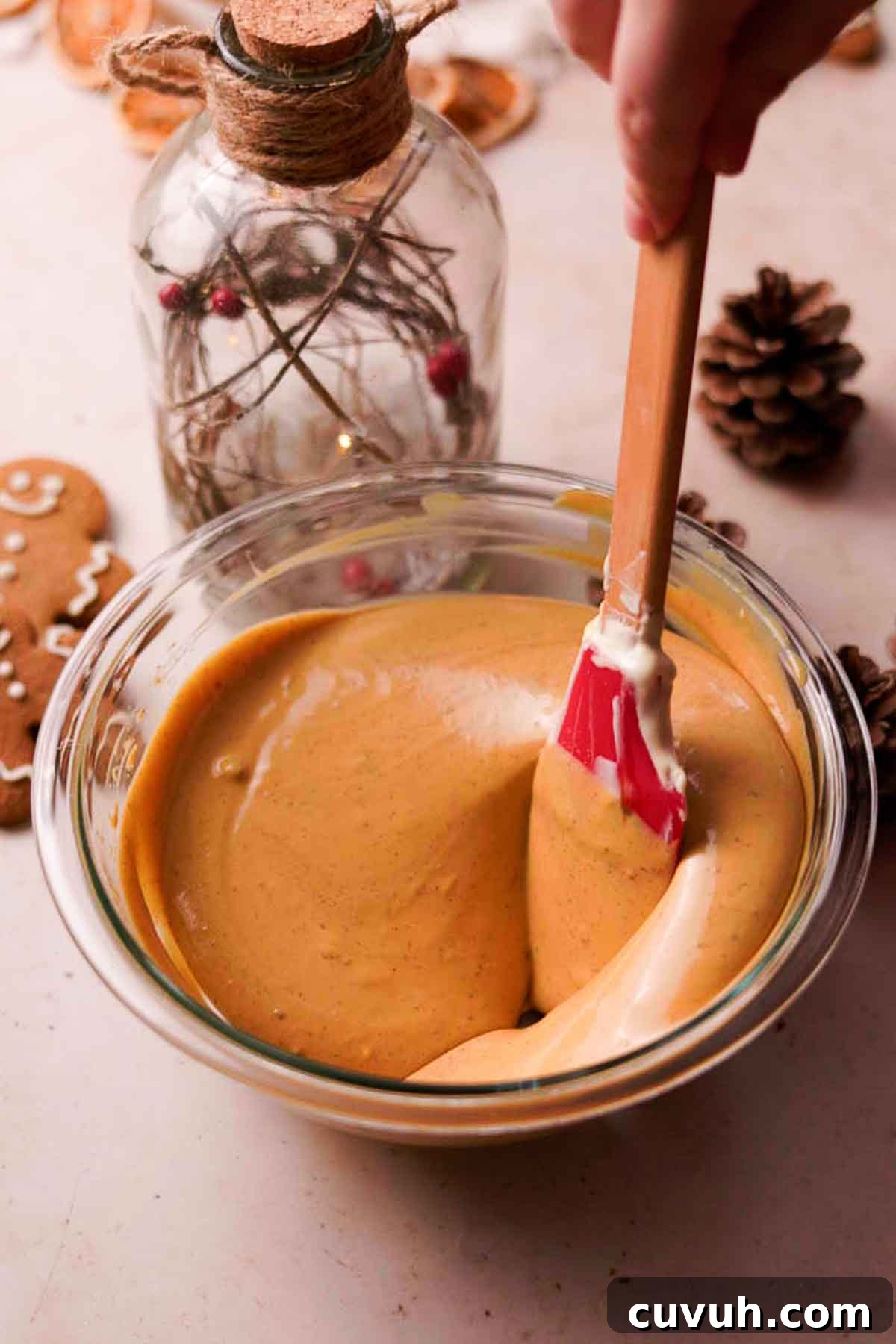 Gingerbread Cheesecake Recipe with Spiced Graham Crust 11 stirring in molasses to half the batter