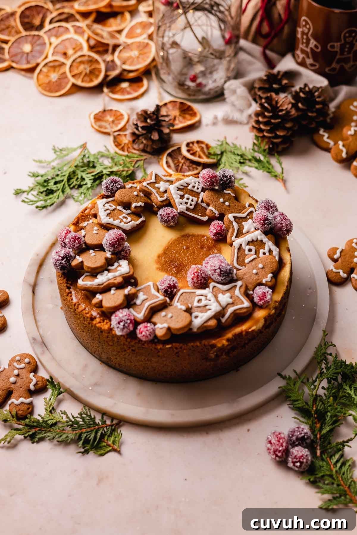 Gingerbread Cheesecake Recipe with Spiced Graham Crust 3 gingerbread cheesecake decorated with gingerbread cookies