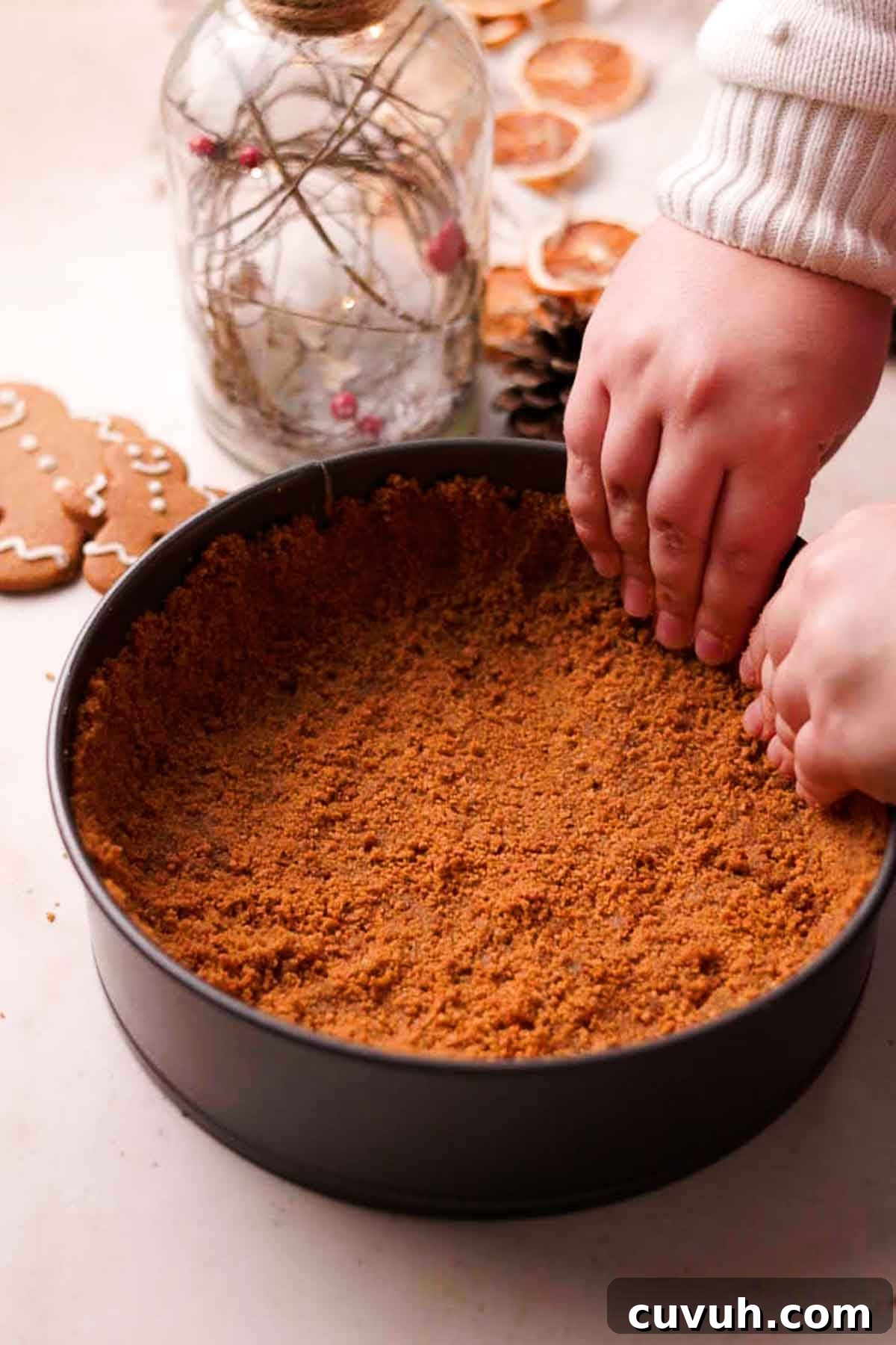 Gingerbread Cheesecake Recipe with Spiced Graham Crust 6 pressing down the crust in the pan