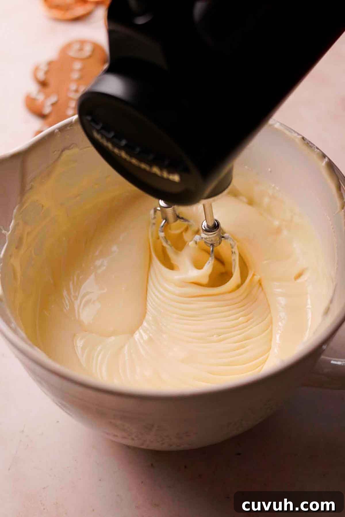 Gingerbread Cheesecake Recipe with Spiced Graham Crust 9 mixing eggs into gingerbread cheesecake batter
