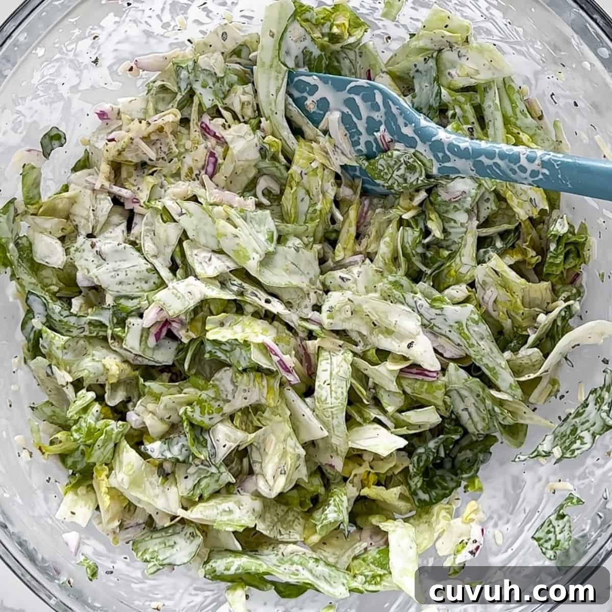 Top Grinder Salad Recipes for Flavorful Sandwiches 6 Mixing in the lettuce with the spiced mayo