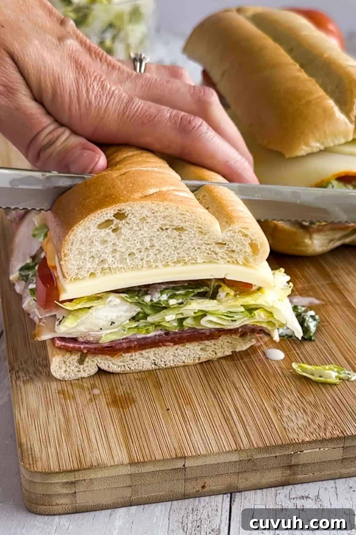Top Grinder Salad Recipes for Flavorful Sandwiches 8 Cutting the grinder salad.