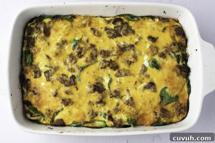 Overhead view of a fully-baked keto breakfast casserole in a white casserole dish.