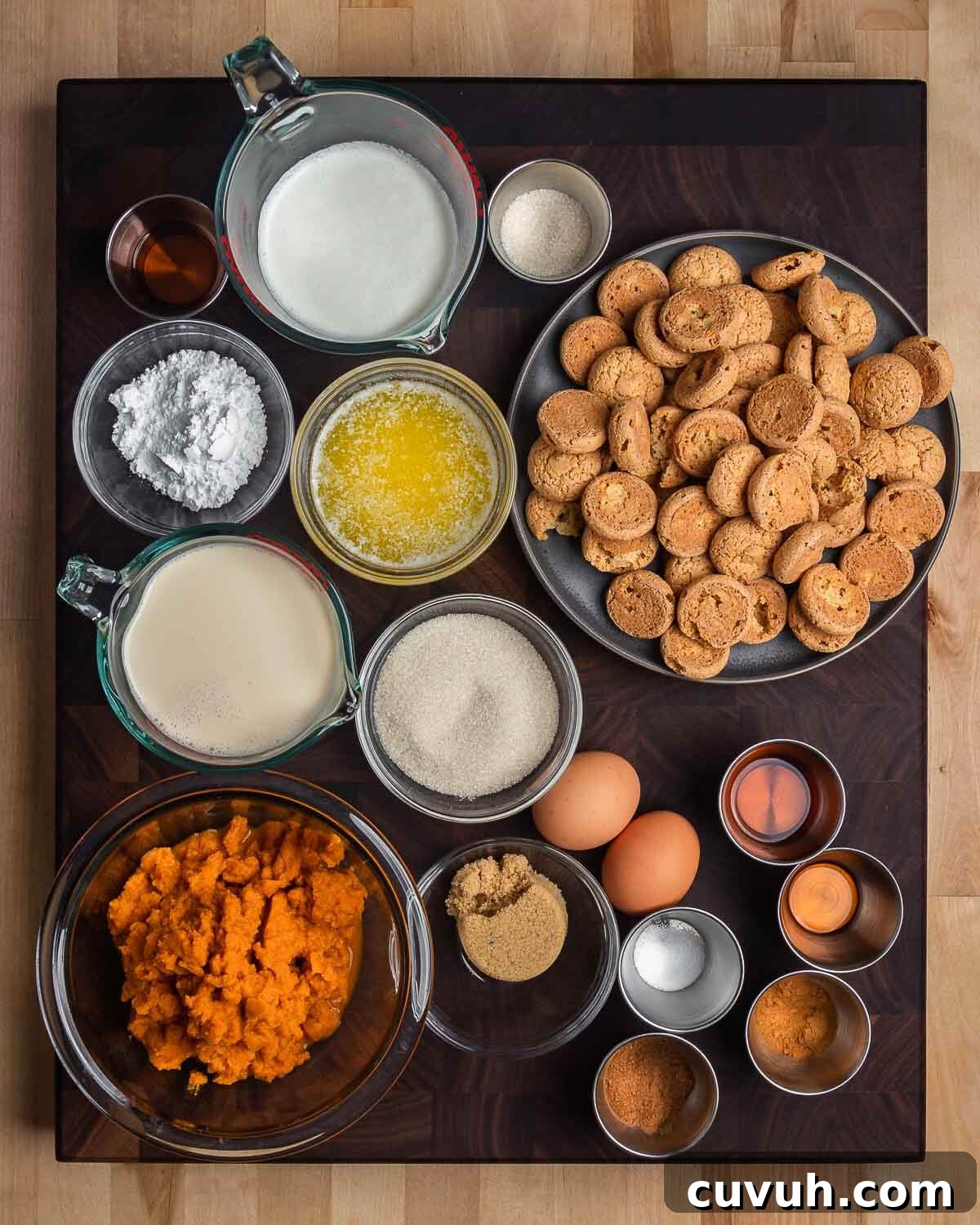 Overhead shot of ingredients for amaretti crust, pumpkin pie, and amaretto whip cream.