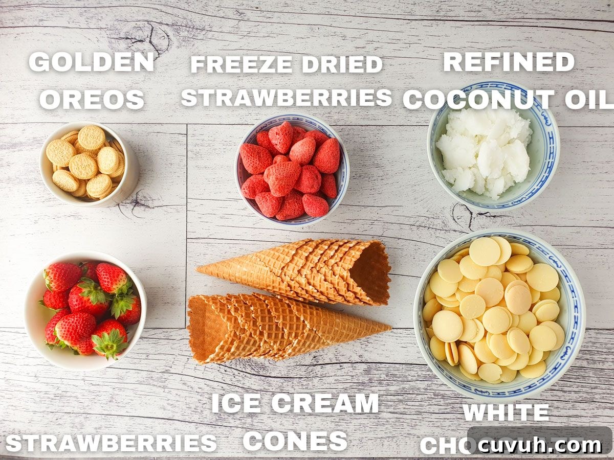 Strawberry Crunch Cheesecake Cones Recipe for Summer Treats 3 Ingredients for strawberry crunch cones: golden Oreos, freeze dried strawberries, refined coconut oil, fresh strawberries, ice cream cones, white chocolate.