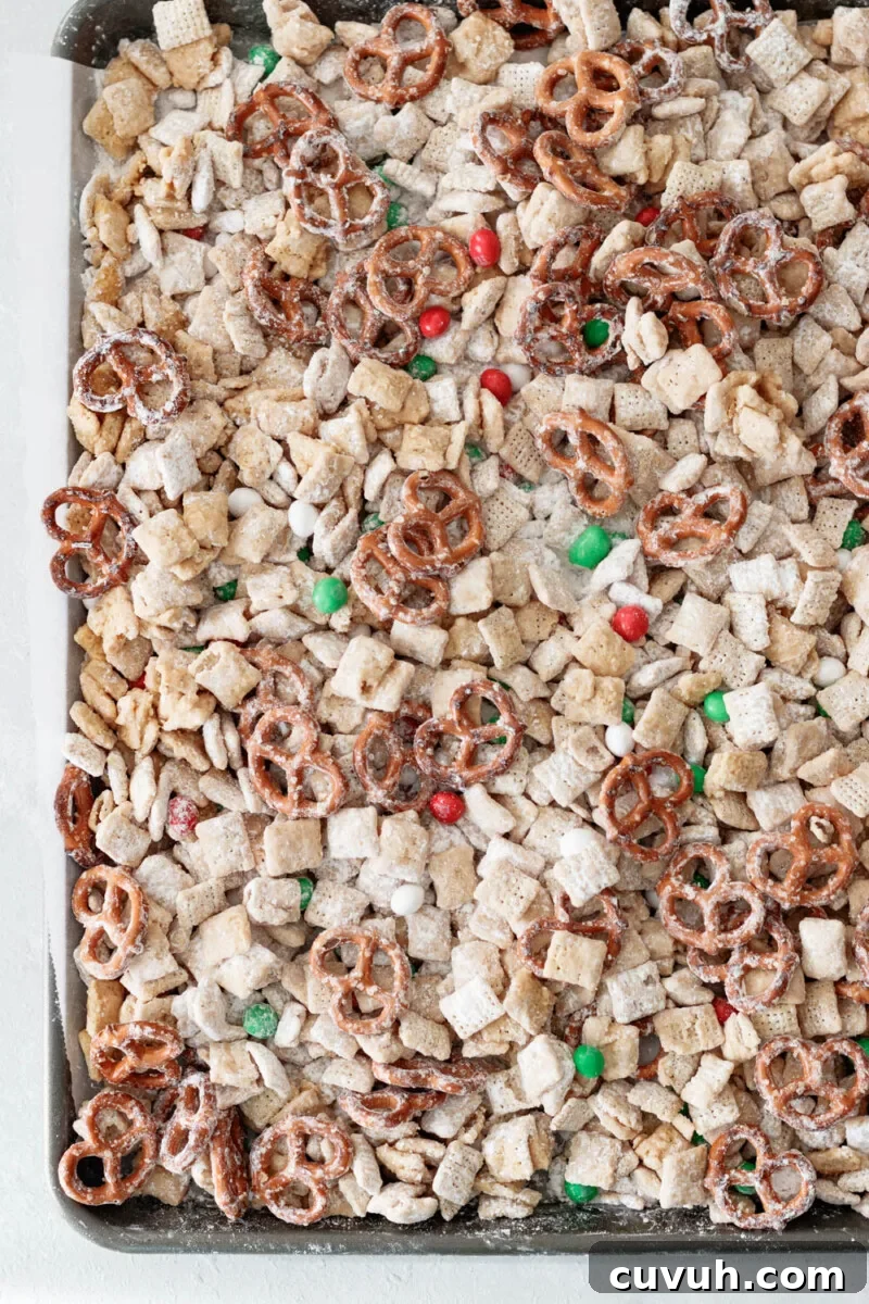 Christmas Puppy Chow Recipe — Festive Reindeer Munch Treats 3 overhead view of the Reindeer munch snack mix on a baking sheet