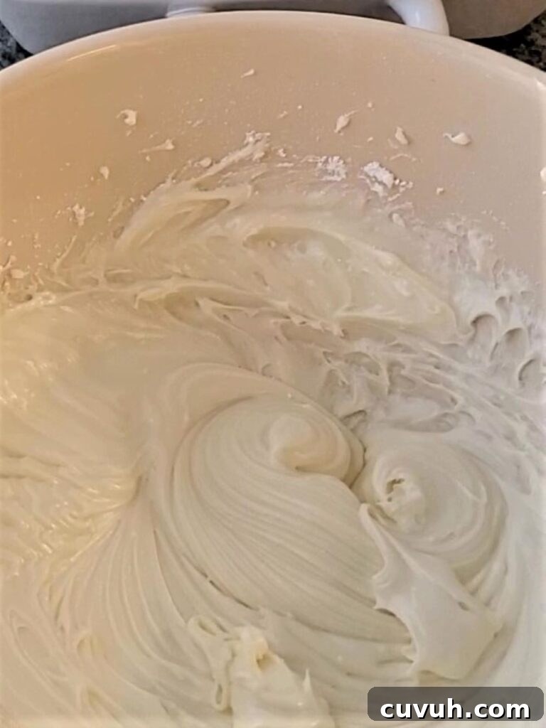 cream cheese frosting in large white bowl