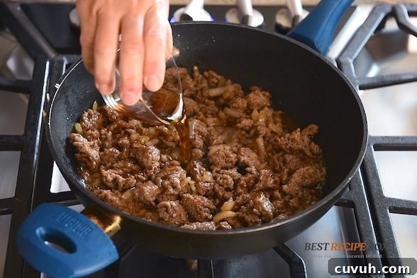 Korean Pork and Kimchi Ramen Stir-Fry Recipe 6 adding sauce