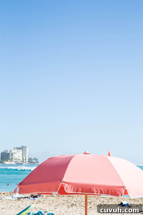 Pink umbrella on the beach.