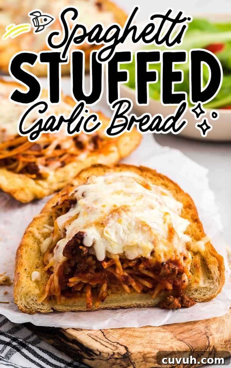 close up shot of a piece of spaghetti stuffed garlic bread on a wooden board