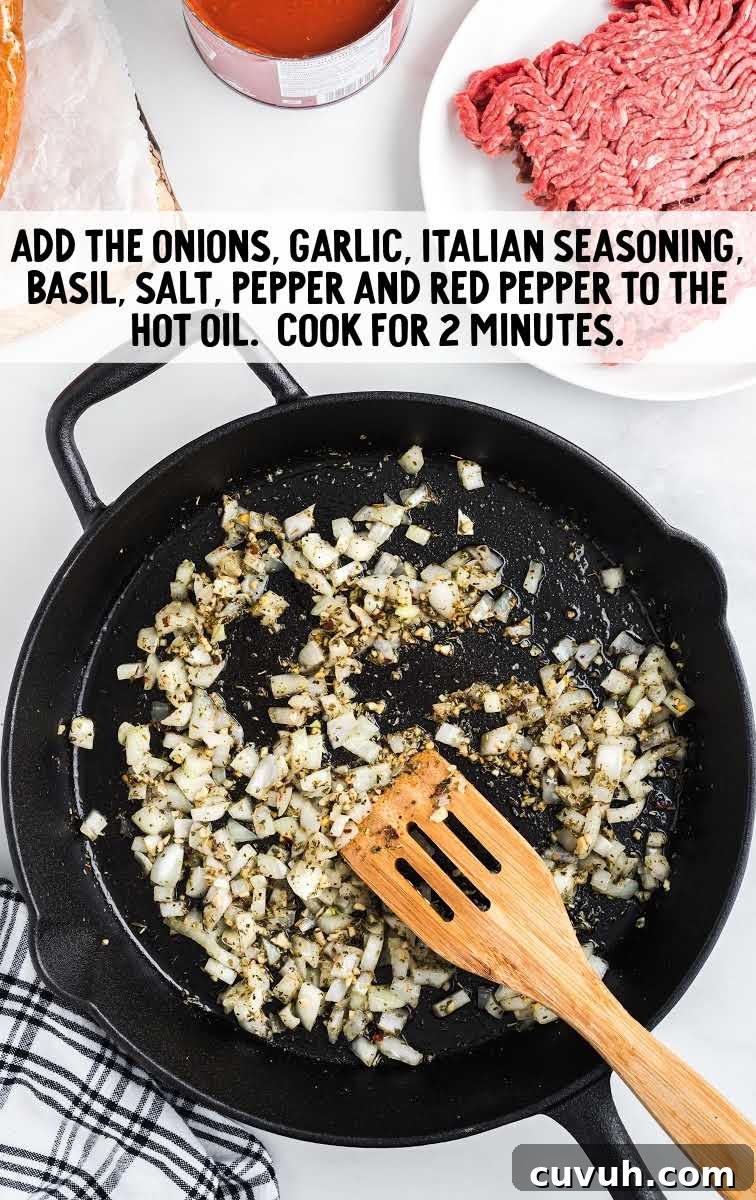 spaghetti stuffed garlic bread process shot of ingredients in a skillet
