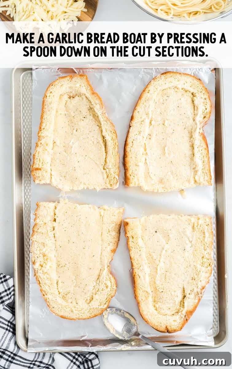 spaghetti stuffed garlic bread process shot of bread on a sheet pan