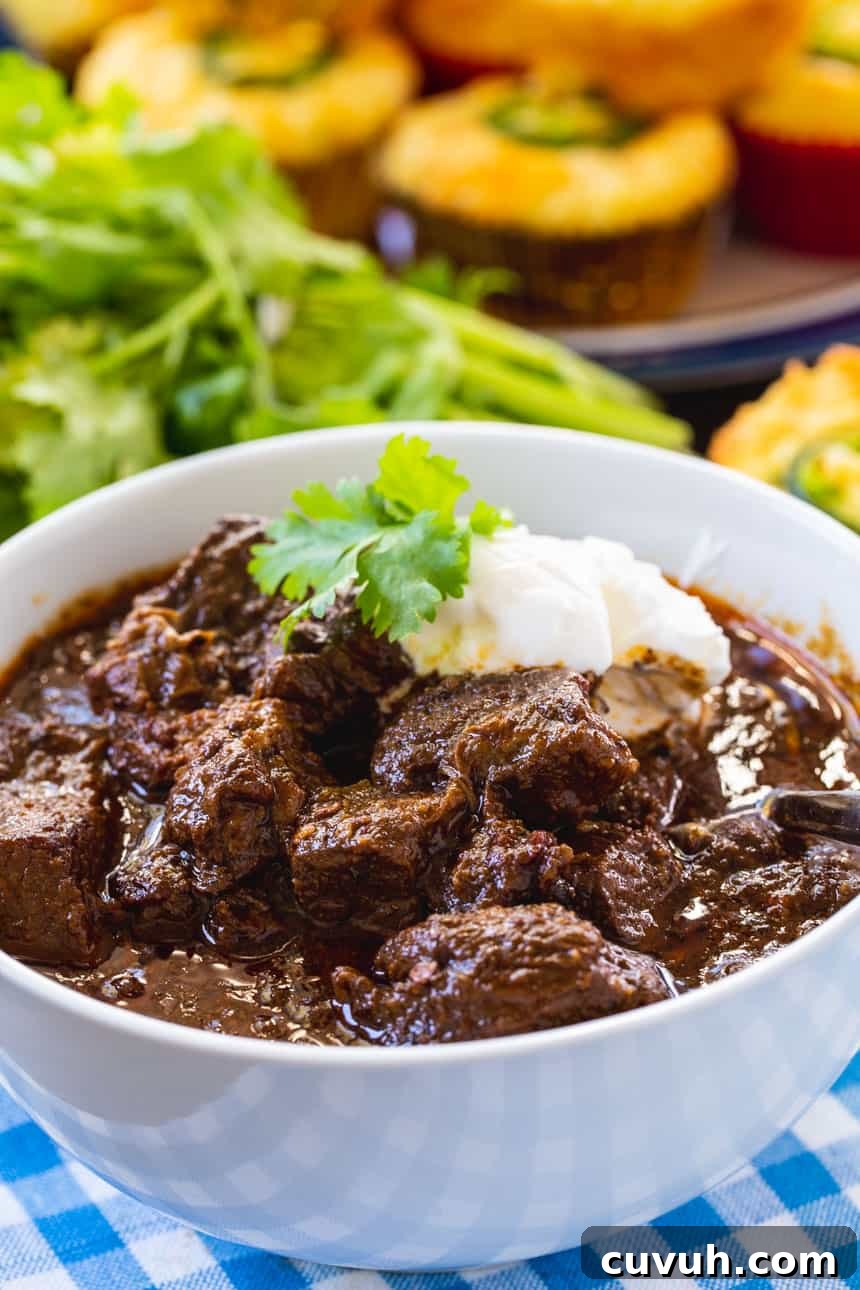 Chili Con Carne with sour cream and cilantro