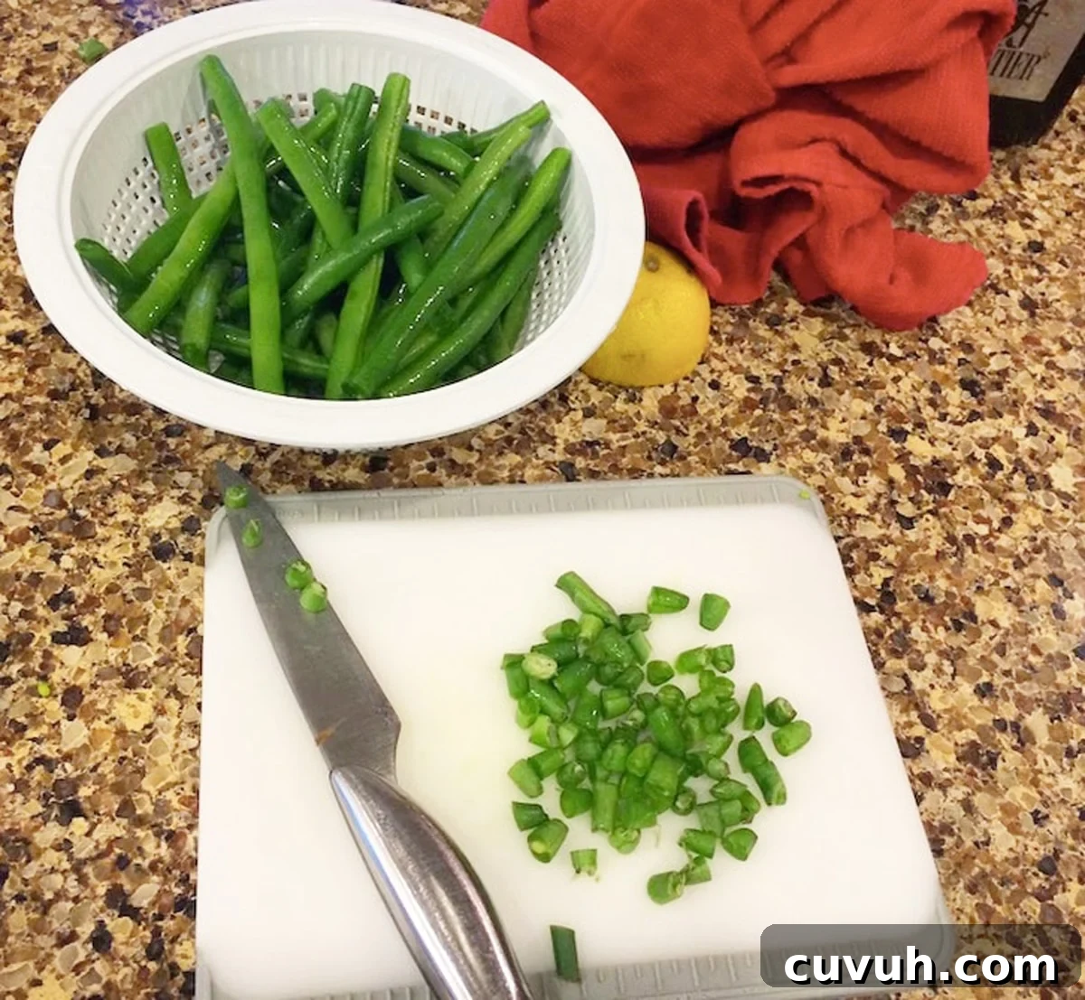 Bowl filled with cut green beans. 