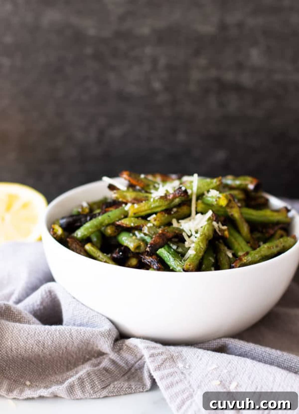 Bowl filled with grilled green beans.