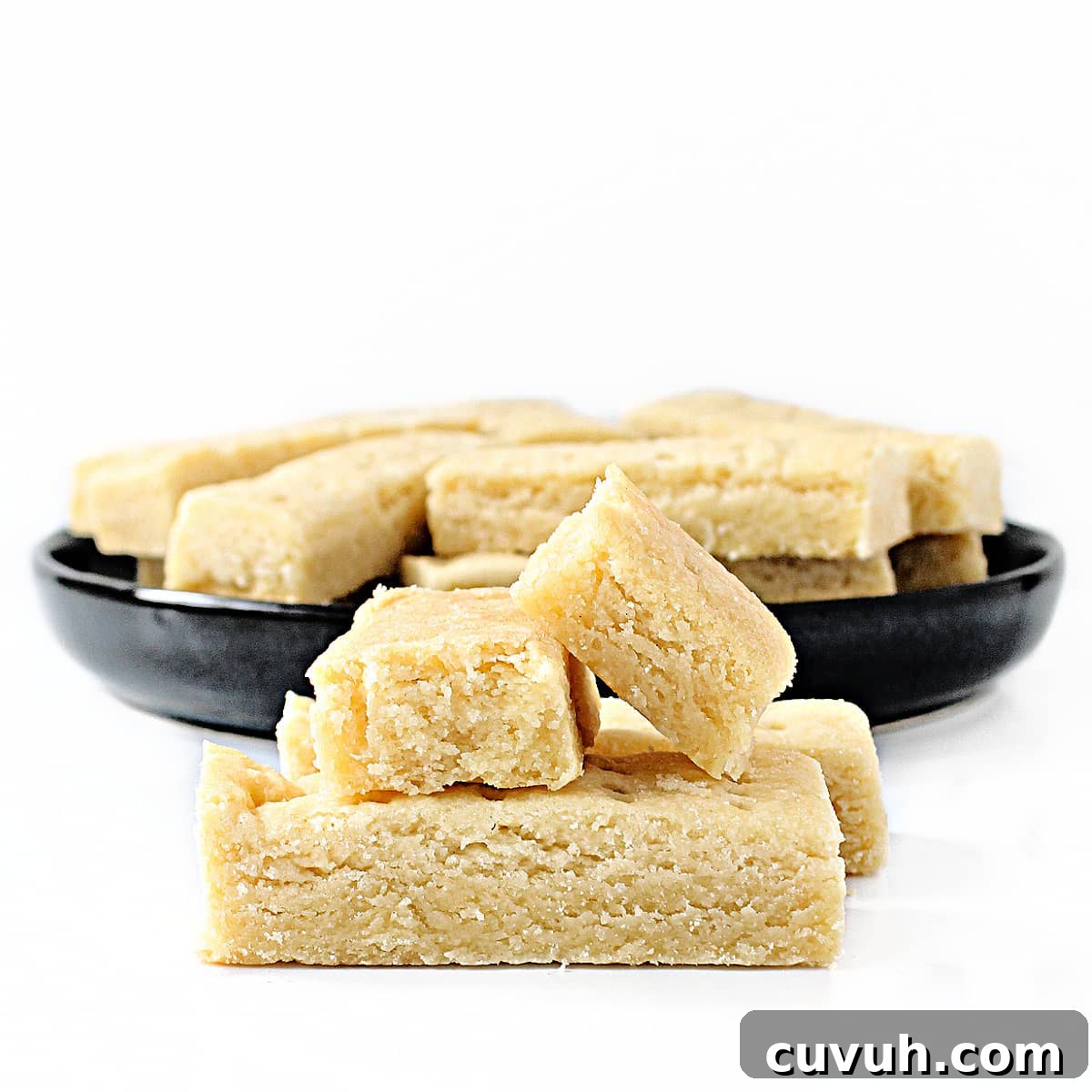 Closeup of shortbread cookie edges showing dense, buttery crumb.